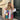 Bohemian embroidered patchwork dress showcasing intricate artisan design, featuring colorful patterns and a flowing summer style, worn by a model accessorized with sunglasses.