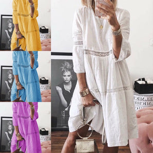 Bohemian embroidered white dress featuring intricate detailing, short sleeves, and a relaxed fit, perfect for casual chic summer fashion.