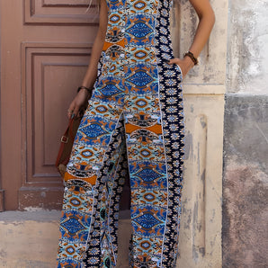 Bohemian Ethnic Print Wide-Leg Summer Jumpsuit in blue and purple tones, featuring a one-piece design with short sleeves, a defined waist, and a wide-legged silhouette.