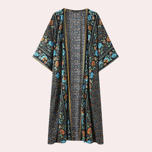 
A woman's long, flowy kimono featuring a bohemian floral ethnic print, with long sleeves and an open front design, resembling a casual cardigan style.