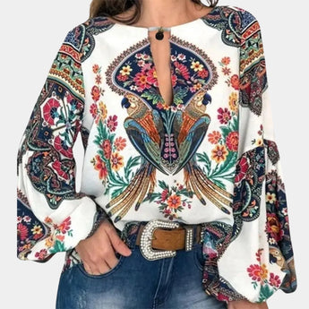 Bohemian Floral Paisley Women's Ethnic Blouse in white with pink floral paisley patterns, featuring a relaxed fit with a round neck, long sleeves, and a slightly loose waist, suitable for festivals and casual outings.