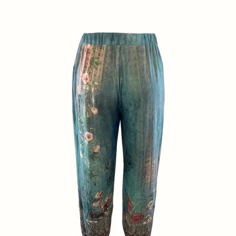 Bohemian Floral Print Women's Trousers featuring a relaxed fit and elastic waist, shown in a casual setting.