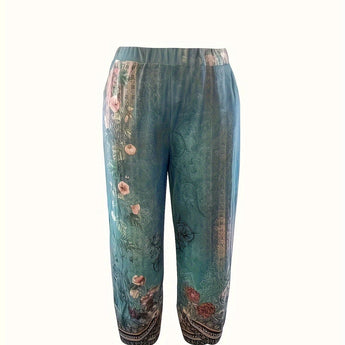 Bohemian floral print women's trousers with a relaxed fit and elastic waistband, featuring a vibrant design in electric blue.