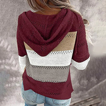 Bohemian handmade hooded crochet sweater in beige and pink, featuring a knit design with long sleeves and a cozy hood.