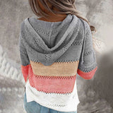 Bohemian handmade hooded crochet sweater in beige and pink with a knit hoodie, featuring a unique pattern and woolen texture.