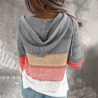 Bohemian handmade hooded crochet sweater in beige and pink with a knit hoodie, featuring a unique pattern and woolen texture.