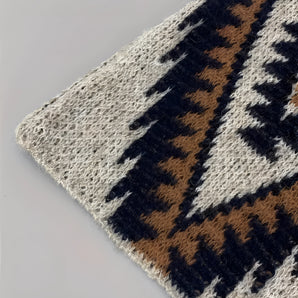 Bohemian handwoven wool rug with a tribal geometric design, featuring vibrant patterns and rich textures in electric blue hues.