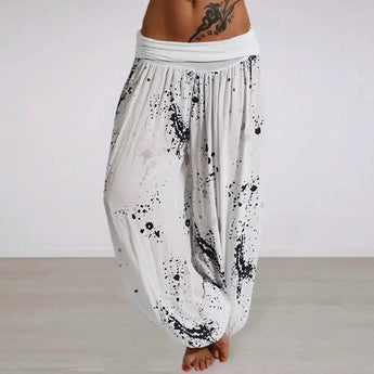 Bohemian Ink Splash Harem Pants in white with a loose fit, designed for yoga and casual wear, shown in size 3XL. The pants feature a unique splash pattern and are styled for comfort with a relaxed waist and wide legs.