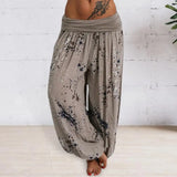 Loose-fit Bohemian ink splash harem pants in persimmon color, size 3XL, featuring a vibrant motif. The trousers are styled for yoga with a relaxed waist and thigh fit, emphasizing comfort and flexibility.
