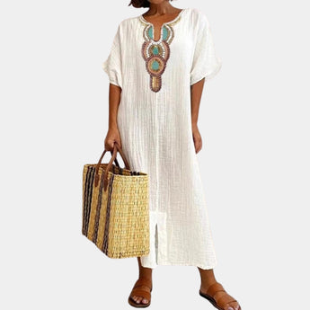 Bohemian light blue maxi dress featuring intricate ethnic embroidery, designed with a relaxed fit and long sleeves, suitable for plus-size fashion.