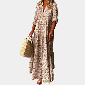 Bohemian Light Blue V-Neck Maxi Dress with a Geometric Tribal Print, featuring long sleeves and a defined waist, perfect for daytime fashion.