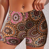 Bohemian Mandala High Waist Festival Beach Shorts with vibrant summer patterns, modeled by a person showcasing the shorts' colorful design and high waist fit.