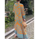 Bohemian Moroccan Print Maxi Kaftan in orange and blue with long sleeves, featuring a loose, flowing fit suitable as a beach cover-up.