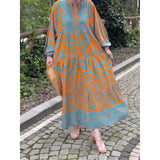 Bohemian Moroccan Print Maxi Kaftan in orange and blue, featuring a vibrant pattern, long sleeves, and a flowing maxi design suitable as a beach cover-up.