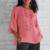 
A pink oversized linen tunic designed for women, featuring a loose casual fit perfect for summer. The blouse has a relaxed shoulder design, a round neck, and long sleeves. The tunic is displayed in size 4XL.