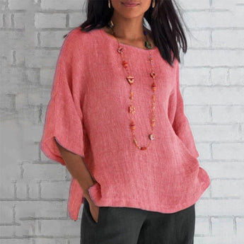 
A pink oversized linen tunic designed for women, featuring a loose casual fit perfect for summer. The blouse has a relaxed shoulder design, a round neck, and long sleeves. The tunic is displayed in size 4XL.