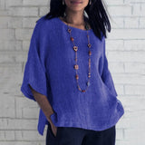 
A blue oversized linen tunic for women, designed as a casual summer blouse in size 4XL, featuring long sleeves, a relaxed fit, and a comfortable neckline.
