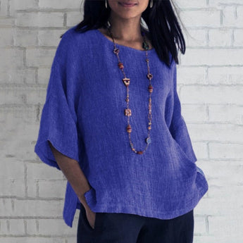 
A blue oversized linen tunic for women, designed as a casual summer blouse in size 4XL, featuring long sleeves, a relaxed fit, and a comfortable neckline.