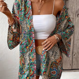 Bohemian Paisley Kimono in a vibrant green color, designed as a summer jacket and beach cover-up, featuring a flowing one-piece garment style with a paisley pattern, shown in size 2XL.