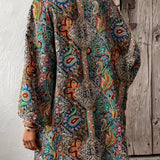 Colorful Bohemian Paisley Kimono worn as a summer jacket and beach cover-up, featuring a flowing design with vibrant patterns, draped over the shoulders and extending to the waist, showcasing a stylish collar and loose sleeves.