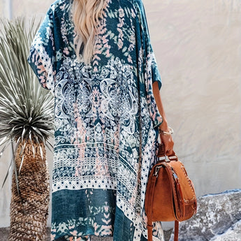 Bohemian teal floral kimono with lightweight fabric, featuring a relaxed fit, open front, and flowing sleeves, worn as a summer cover-up.