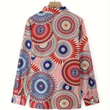 Colorful geometric mandala print V-neck blouse with tie-waist and long sleeves in magenta hues.