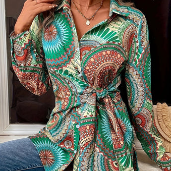 Bohemian tie-waist blouse with a colorful geometric mandala print, V-neck design, long sleeves, and adjustable waist belt.