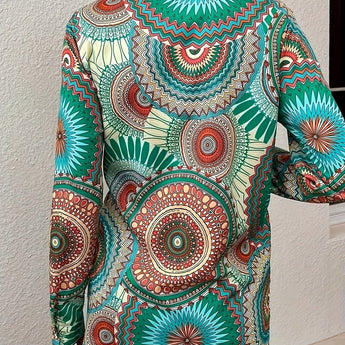 Bohemian tie-waist blouse with colorful geometric mandala print, featuring a V-neck and long sleeves.