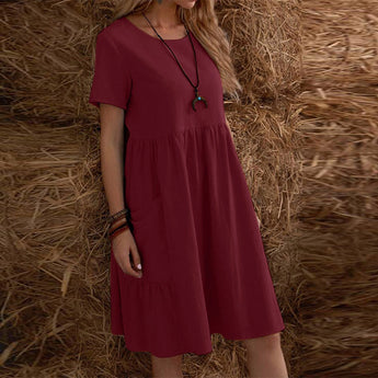 Bohemian tiered midi dress in grey featuring a scoop neck and short sleeves, designed for plus size. The dress has a flowing silhouette with a waistline detail and is suitable for casual day wear.