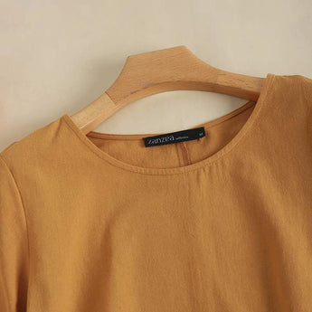 Bohemian Tiered Midi Dress in brown, featuring a scoop neck and short sleeves, displayed on a clothes hanger.