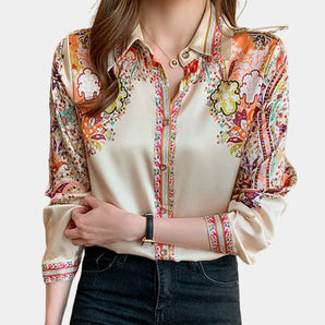 Bohemian women's floral print V-neck blouse with long sleeves, featuring a loose-fitting design suitable for spring fashion.