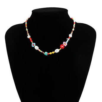 Multicolor pearl Boho bead choker necklace featuring floral and trendy designs, accessorized with gemstones and fashion elements, displayed on a neck model.