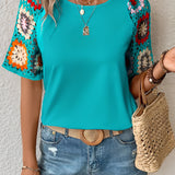 Boho chic black blouse with floral crochet sleeves in turquoise color, featuring a 2XL size.