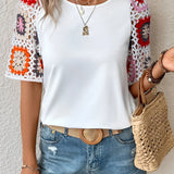 Boho Chic Black Blouse with Floral Crochet Sleeves in white, featuring a stylish and comfortable design with intricate crochet details on the sleeves, suitable for casual or dressy occasions.