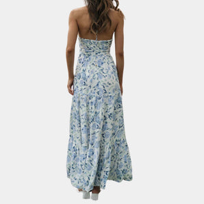 Boho Chic Blue Floral Strapless Maxi Dress with ruffled detailing, featuring a vibrant electric blue floral pattern, designed as a one-piece gown suitable for summer outings and formal occasions.