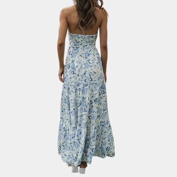 Boho Chic Blue Floral Strapless Maxi Dress with ruffled detailing, featuring a vibrant electric blue floral pattern, designed as a one-piece gown suitable for summer outings and formal occasions.