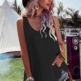 Boho-Chic Crochet Back Sundress in Nero, size 2XL, modeled by a person wearing a wide-brimmed hat and sunglasses, showcasing the dress's flowy design with its crochet detailing, perfect for a summer festival setting.