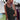 Boho-Chic Crochet Back Sundress in Nero, size 2XL, modeled by a person wearing a wide-brimmed hat and sunglasses, showcasing the dress's flowy design with its crochet detailing, perfect for a summer festival setting.