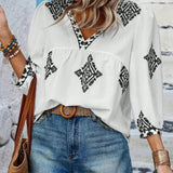 Boho Chic Ethnic Print Blouse, the Amalia V-Neck Summer Top 2023, featuring a stylish ethnic print with a V-neckline, short sleeves, and a relaxed fit suitable for warm weather.