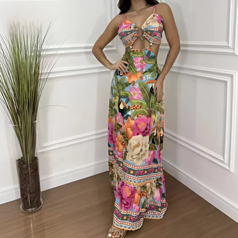 Boho Chic Floral Maxi Dress with cutout waist, featuring a vibrant purple hue, styled as beachwear.