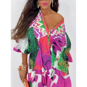 Boho chic long sleeve maxi dress featuring an abstract print with vibrant pink and violet colors, showcasing design elements such as a defined waist, stylish collar, and elegant shoulder and neck details.