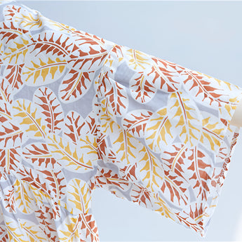 Boho chic V-neck blouse for women featuring a wide sleeve design and a leaf pattern in an orange color scheme.