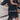 Boho-Chic V-Neck Mini Dress in monochrome, featuring a white and black pattern, short sleeves, and a defined waist, suitable for summer or as a beach cover-up.
