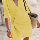 Boho-Chic V-Neck Mini Dress in yellow, styled as a summer dress and beach cover-up, featuring a flattering V-neckline, short sleeves, and a comfortable fit in size XL.