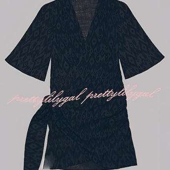 Boho-Chic V-Neck Mini Dress featuring a vibrant pattern with a mix of magenta and electric blue hues, short sleeves, and a casual, relaxed fit suitable for summer wear or as a beach cover-up.