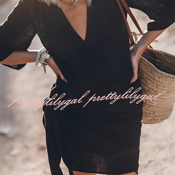 Boho-Chic V-Neck Mini Dress in a summer style, featuring a white fabric with black accents, short sleeves, and a flattering waistline, worn by a model with shoulder-length hair, highlighting the dress's suitability as both a casual summer outfit and a beach cover-up.