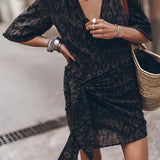 Boho-Chic V-Neck Mini Dress in multicolor, featuring a loose, flowy fit with short sleeves and a flattering v-neckline, ideal for summer outings or as a beach cover-up, shown in XL size.
