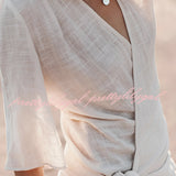 Boho-Chic V-Neck Mini Dress in white, featuring a lightweight textile with short sleeves and a flattering waistline, perfect for summer outings or as a beach cover-up.
