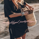 Boho-Chic V-neck mini dress featuring a black and white tartan pattern with short sleeves, designed as a summer dress or beach cover-up.