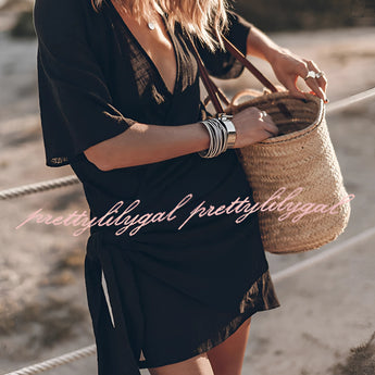Boho-Chic V-neck mini dress featuring a black and white tartan pattern with short sleeves, designed as a summer dress or beach cover-up.